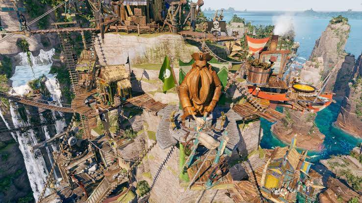 A Corsair Cove pirate camp built across a cliff plateau, linked to neighbouring ledges by rope bridges and ziplines, with workshops and a large carved figure at the centre.